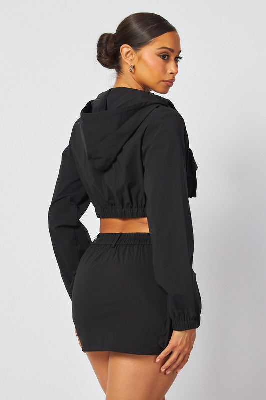 Casual Black 2 piece crop zipper jacket and skirt outfit for all seasons. Everyday outfit for young women.Back view.