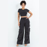 Thumbnail for Cute clothing, black two piece short sleeve cropped top and pants outfit for spring and summer. Everyday outfits for young women. Front view.