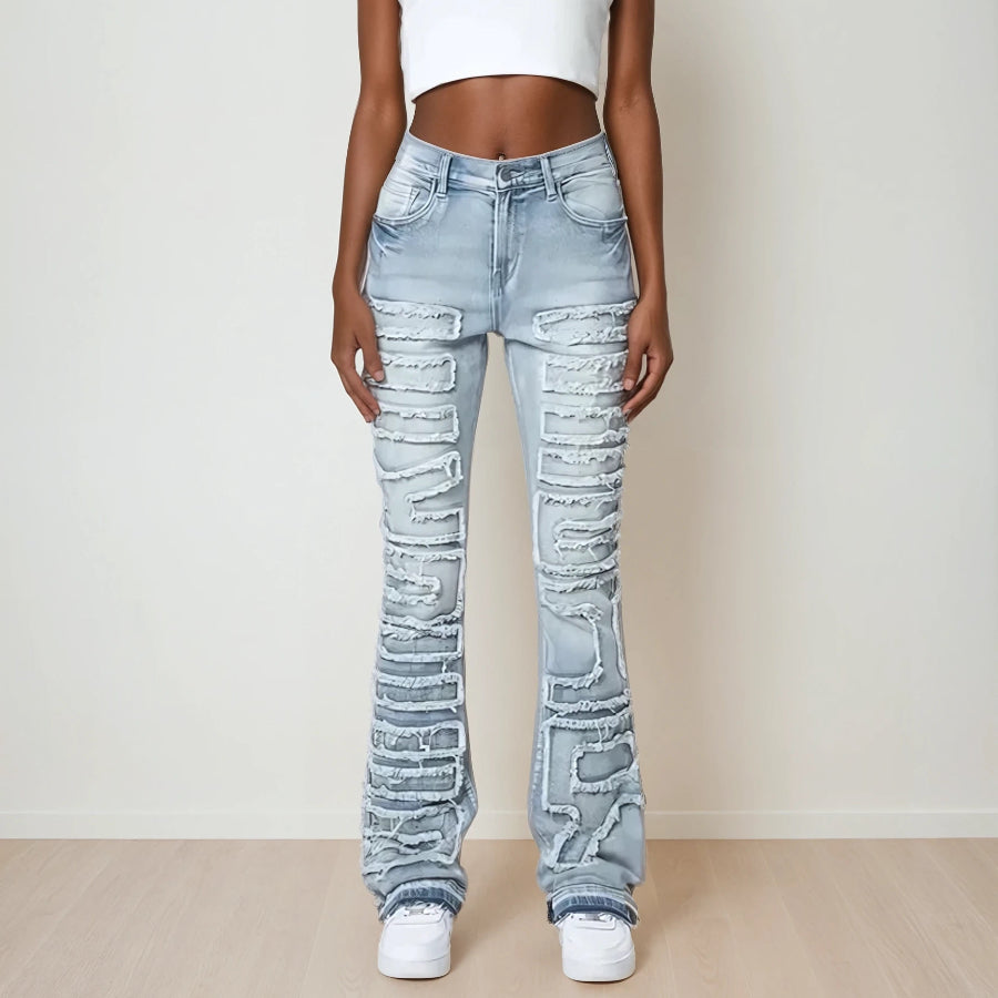 Trendy Y2k inspired blue denim stacked jeans for young women and teenagers. Special detail on front for a stylish look. Close front view.