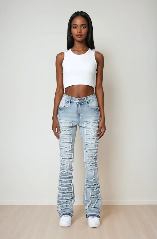 Trendy Y2k inspired blue denim stacked jeans for young women and teenagers. Special detail on front for a stylish look. Front view.