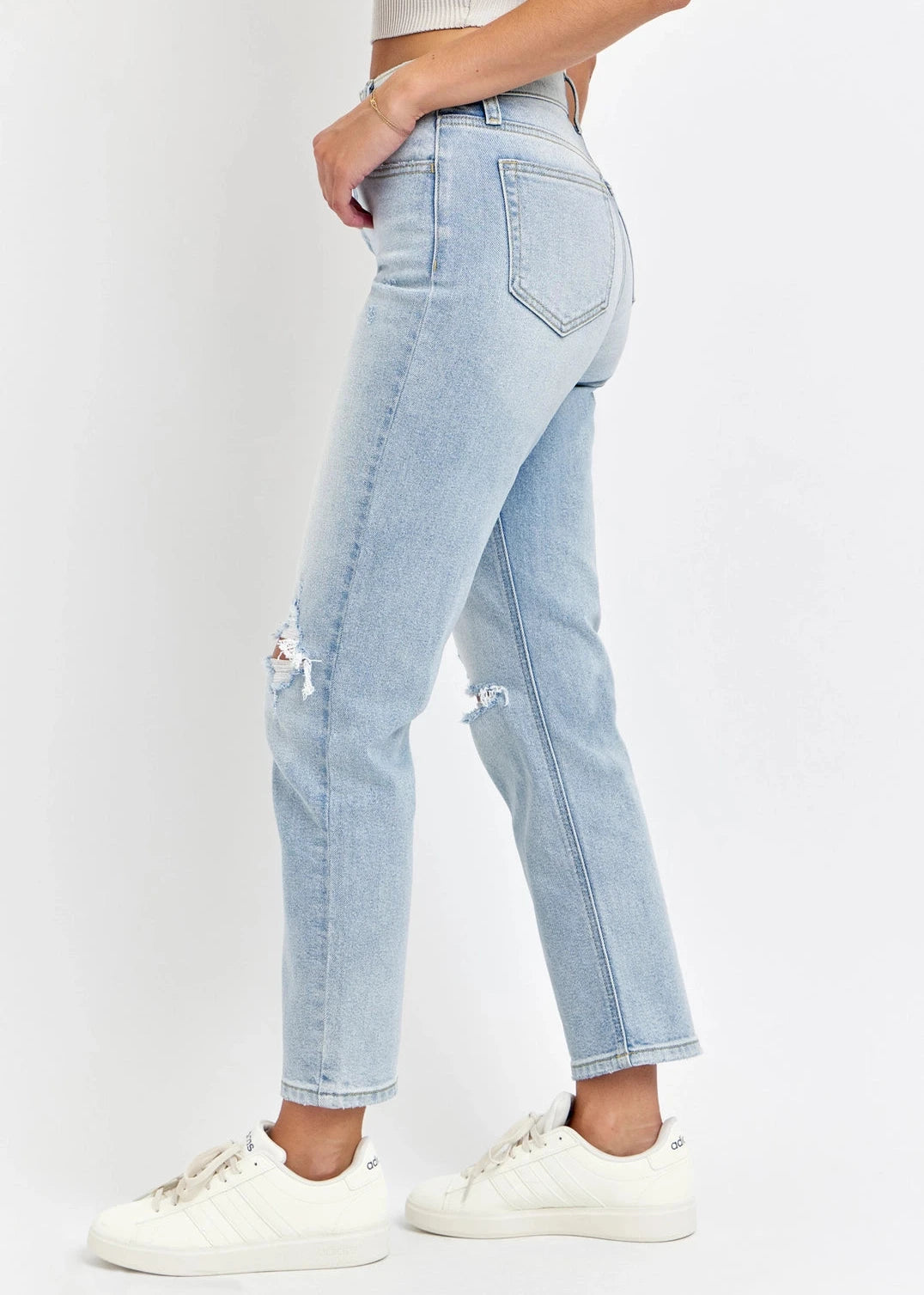 Light blue distressed straight-leg denim with high-rise fit.