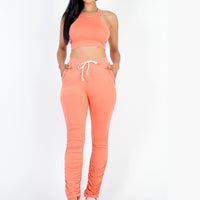 Thumbnail for Lightweight two-piece crop top and ruched pants set for women. Front view.