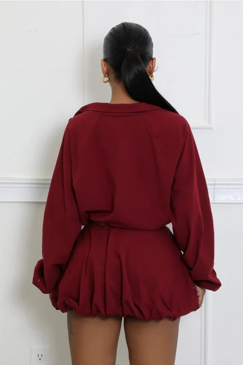 Chic burgundy windbreaker crop jacket and bubble skirt outfit, ideal for a day out with friends or everyday wear. Perfect outfit for teenagers or young women. Back view.