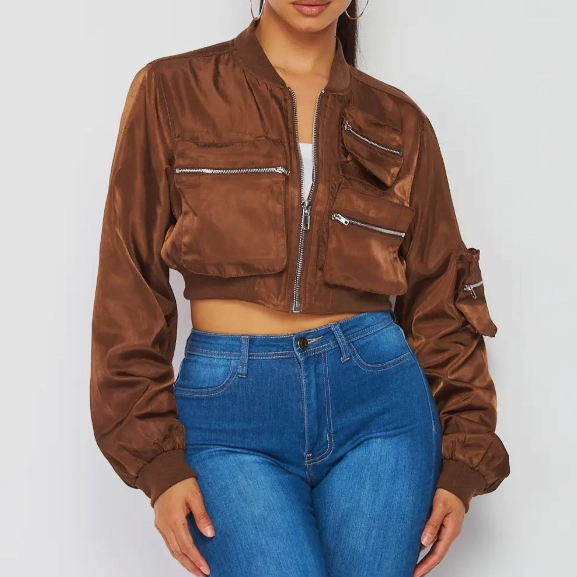 Trendy brown female bomber jacket, crop jacket with zipper details for spring and fall season. Front view.