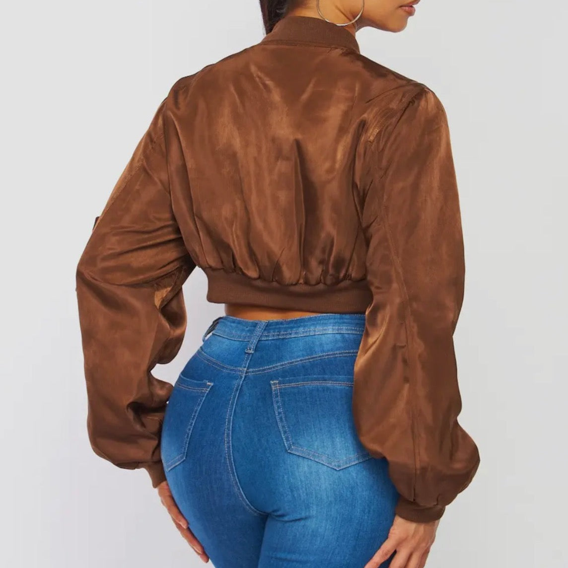 Trendy brown female bomber jacket, crop jacket with zipper details for spring and fall season.  Back view.