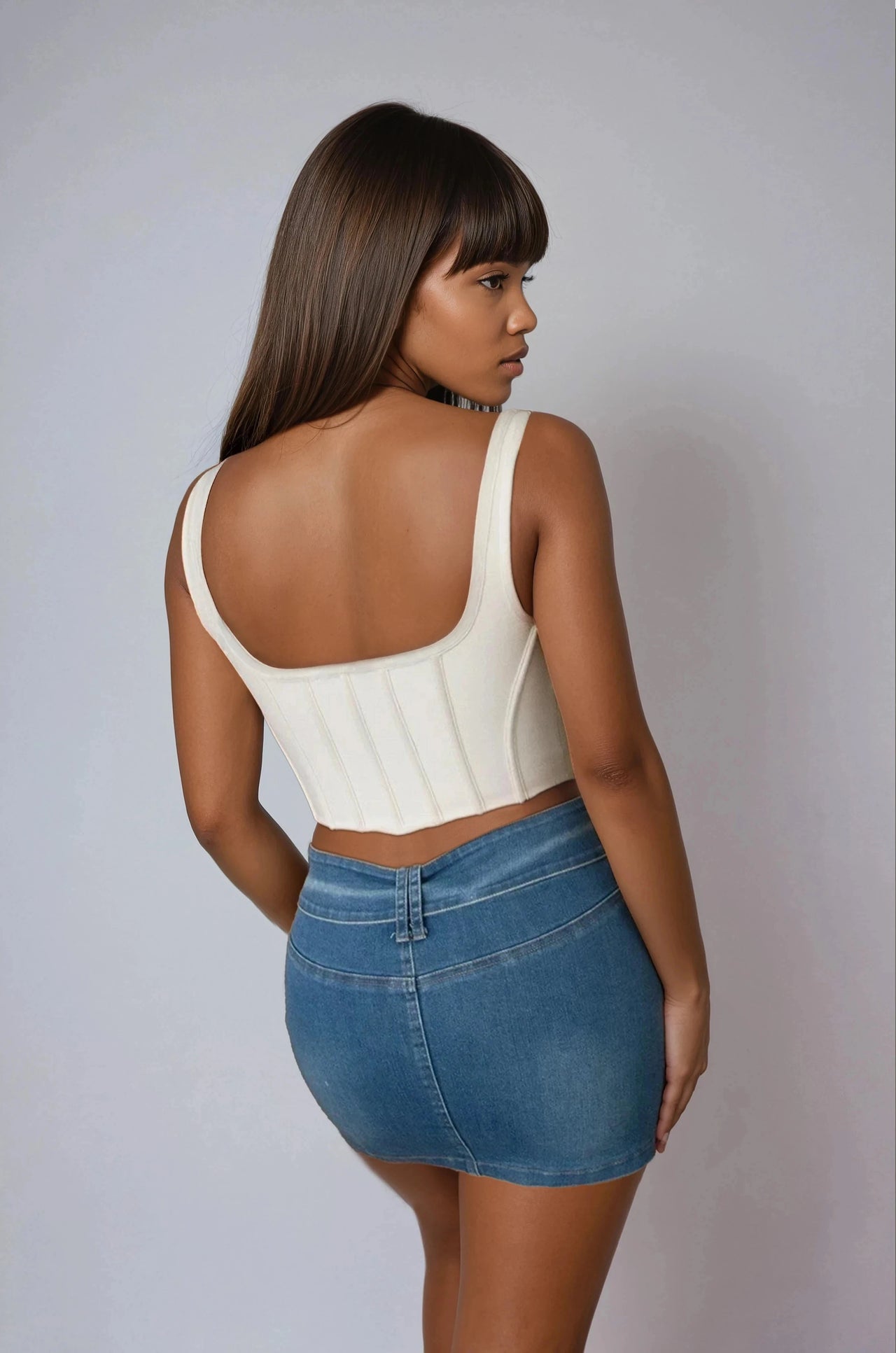 Women's couture lace-up corset top with asymmetrical hem and thick straps