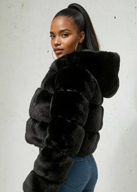 Thumbnail for Woman wearing a black fur coat against a white background