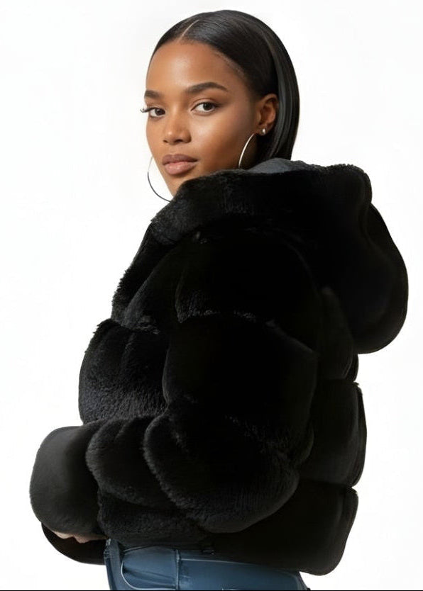 Woman wearing a black fur coat on a white background