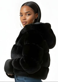 Thumbnail for Woman wearing a black fur coat on a white background