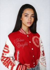 Thumbnail for Cropped varsity jacket with empowering embroidery and bold streetwear style.