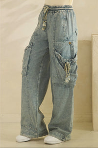 Thumbnail for Blue denim cargo pants on a beige background