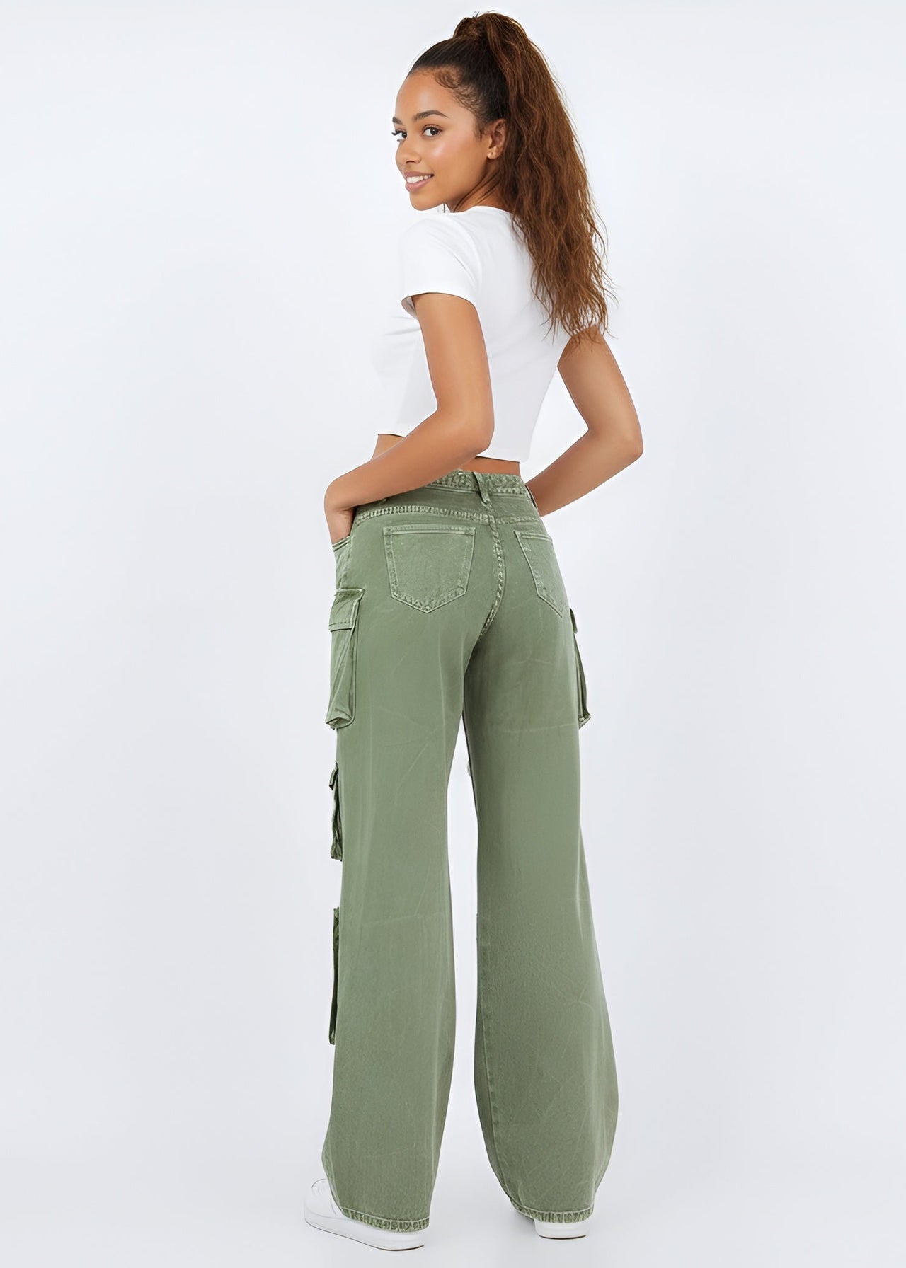 Woman wearing Pink Seal green cargo pants on a white background