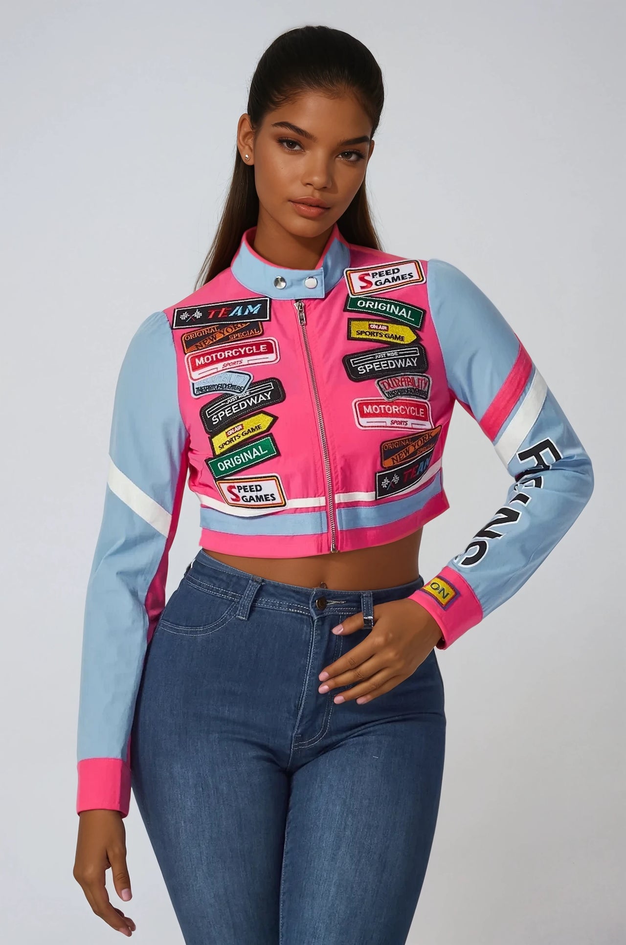 Trendy cropped jacket with patchwork and mock neck, perfect for layering during spring or summer.