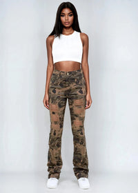 Thumbnail for Woman wearing a white crop top and camouflage pants on a plain background