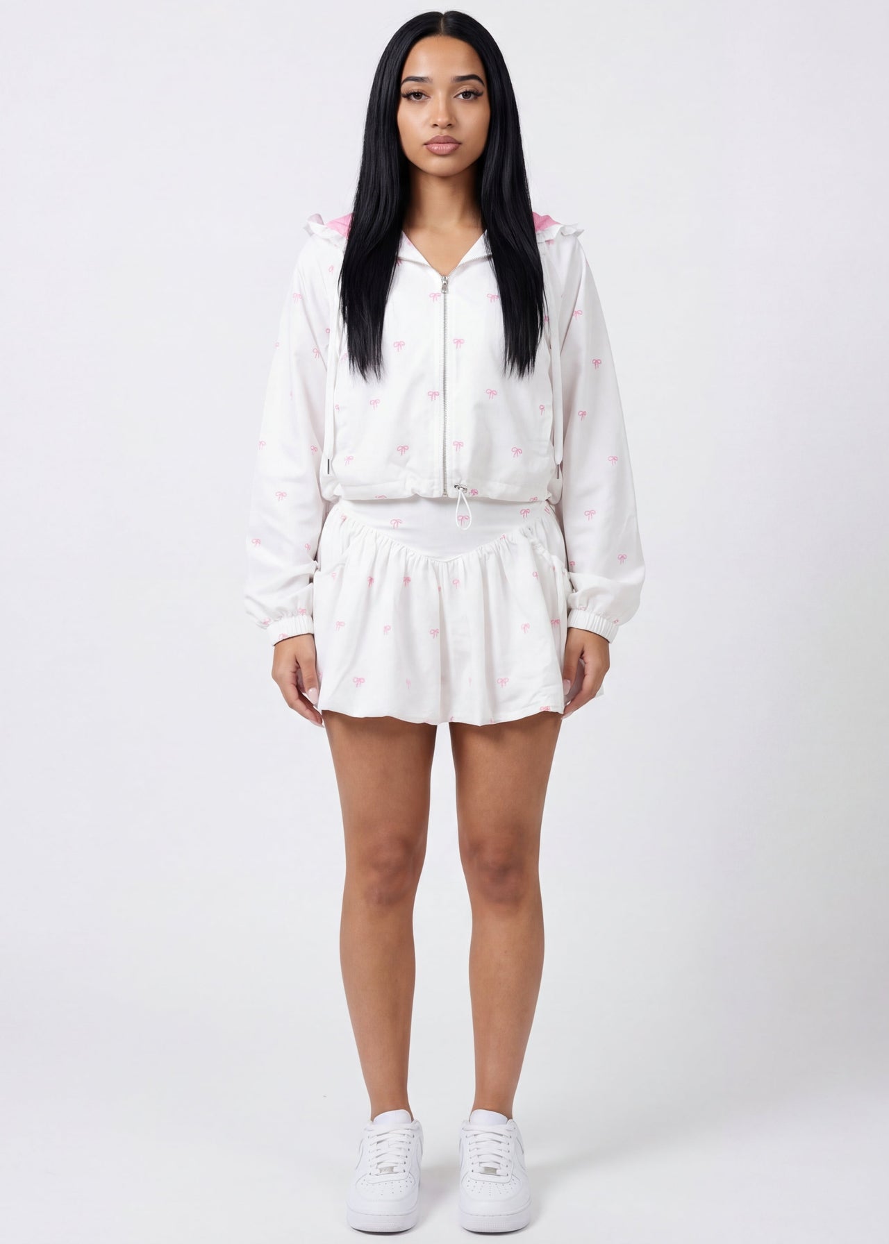 Pink Seal Chic ruffle crop windbreaker and bubble skort in coquette print.