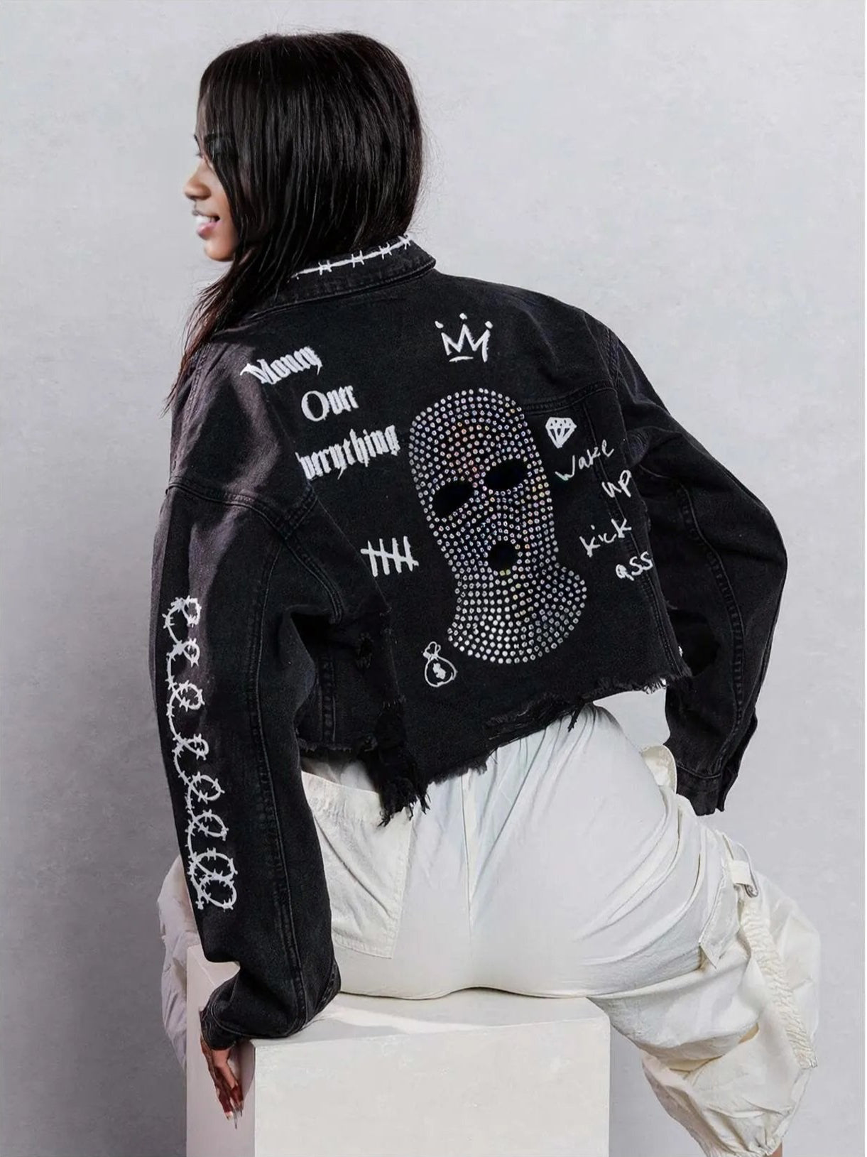 Y2k-inspired cropped jean jacket for layering outfits during all seasons. Black in color.