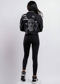 Thumbnail for Person wearing a black outfit with text and graphics on a white background