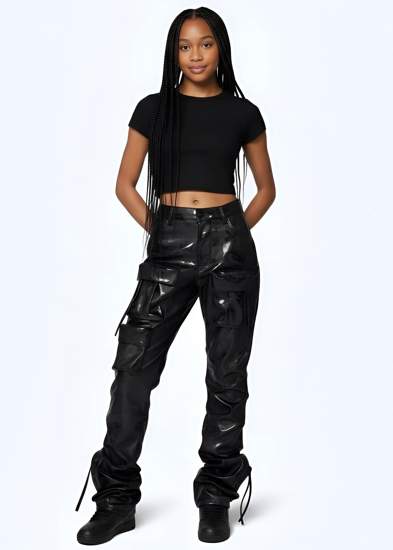 Young women wearing Pink Seal Glossy PU black leather stacked cargo pants with side pinching and pockets.