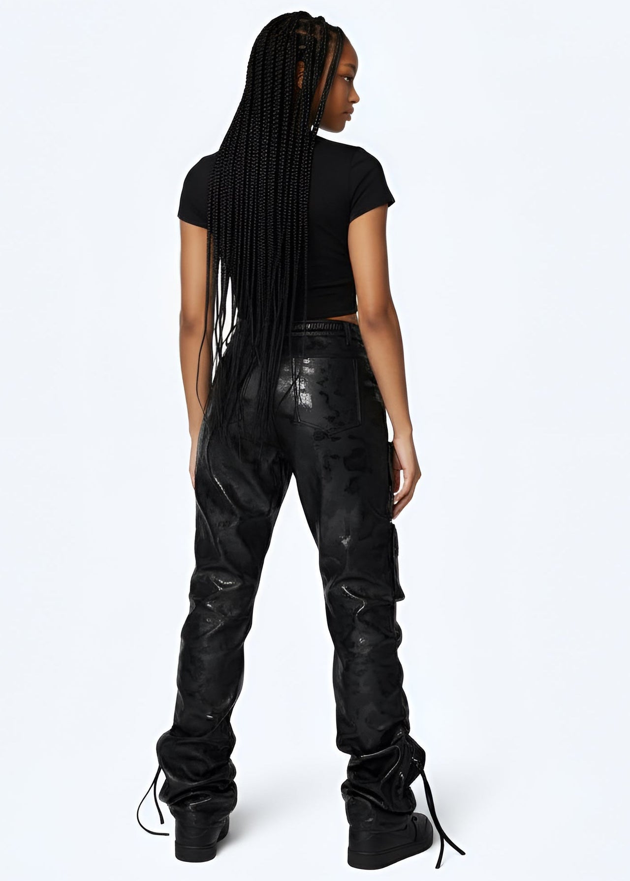 Young women wearing Pink Seal Glossy PU black leather stacked cargo pants with side pinching and pockets.