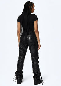 Thumbnail for Young women wearing Pink Seal Glossy PU black leather stacked cargo pants with side pinching and pockets.