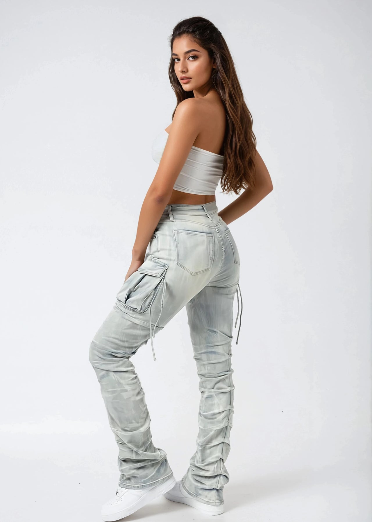 Light blue distressed cargo pants on a white background