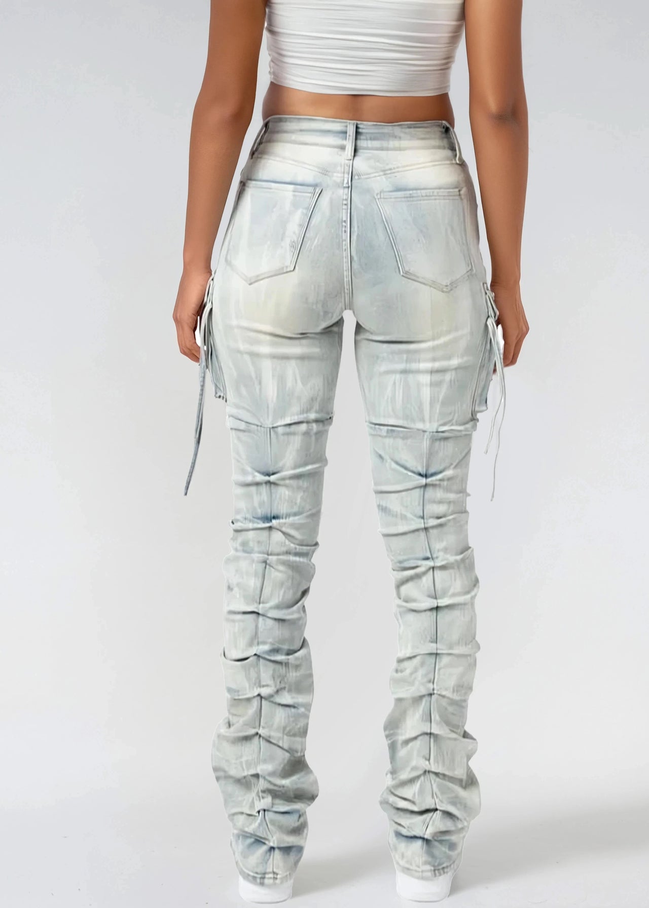 Light blue distressed cargo pants on a white background