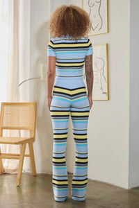 Thumbnail for women wearing striped knit crop top with wide-leg pants in bold multicolor hues.