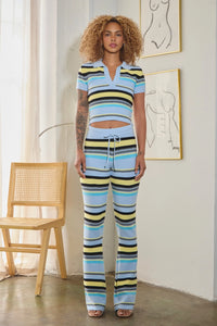 Thumbnail for women wearing striped knit crop top with wide-leg pants in bold multicolor hues.