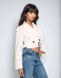 Thumbnail for Chic and bold, the cropped trench coat is made to evolve your look — shine louder in every step.