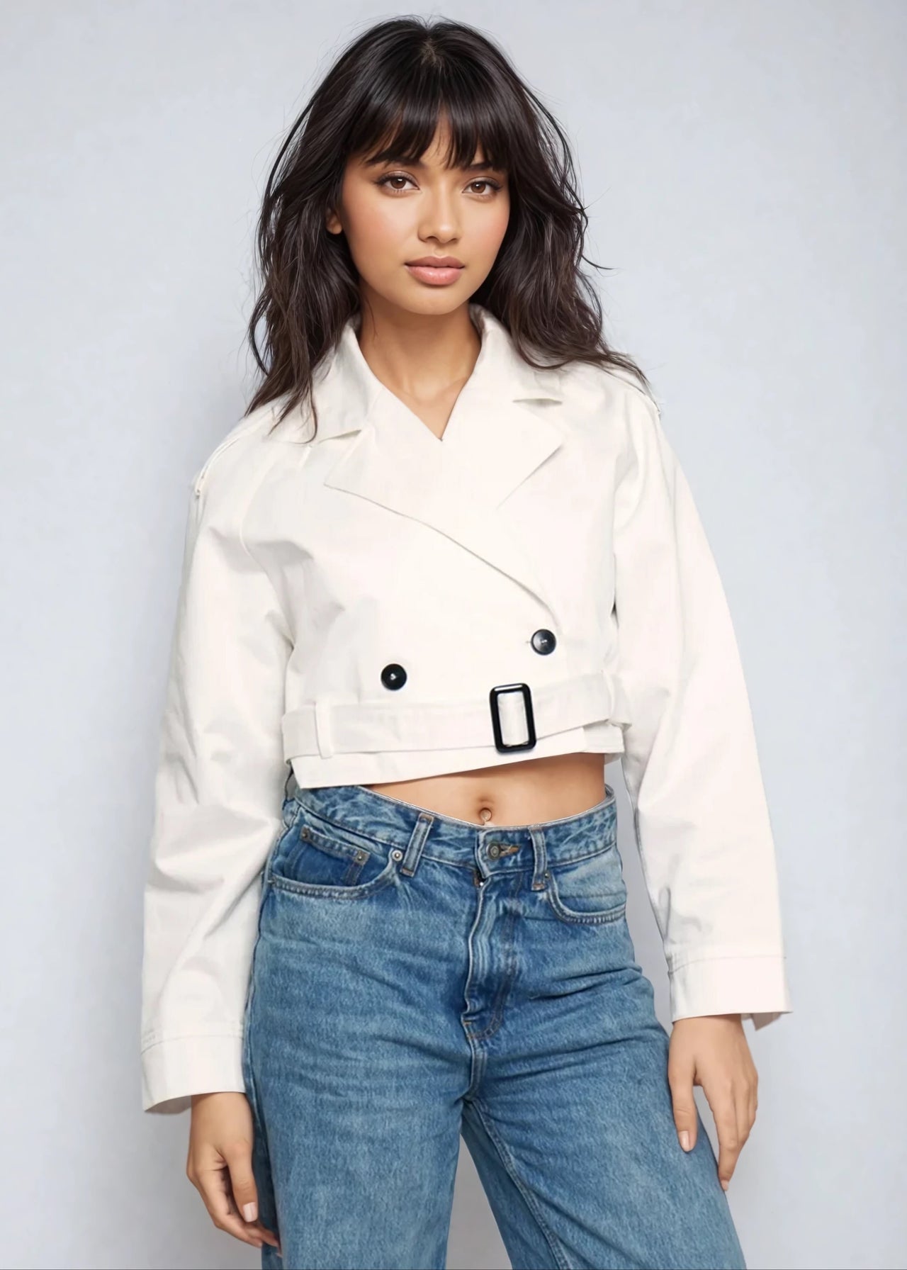Chic and bold, the cropped trench coat is made to evolve your look — shine louder in every step.

