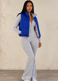 Thumbnail for lady wearing navy blue vest with grey jumpsuit