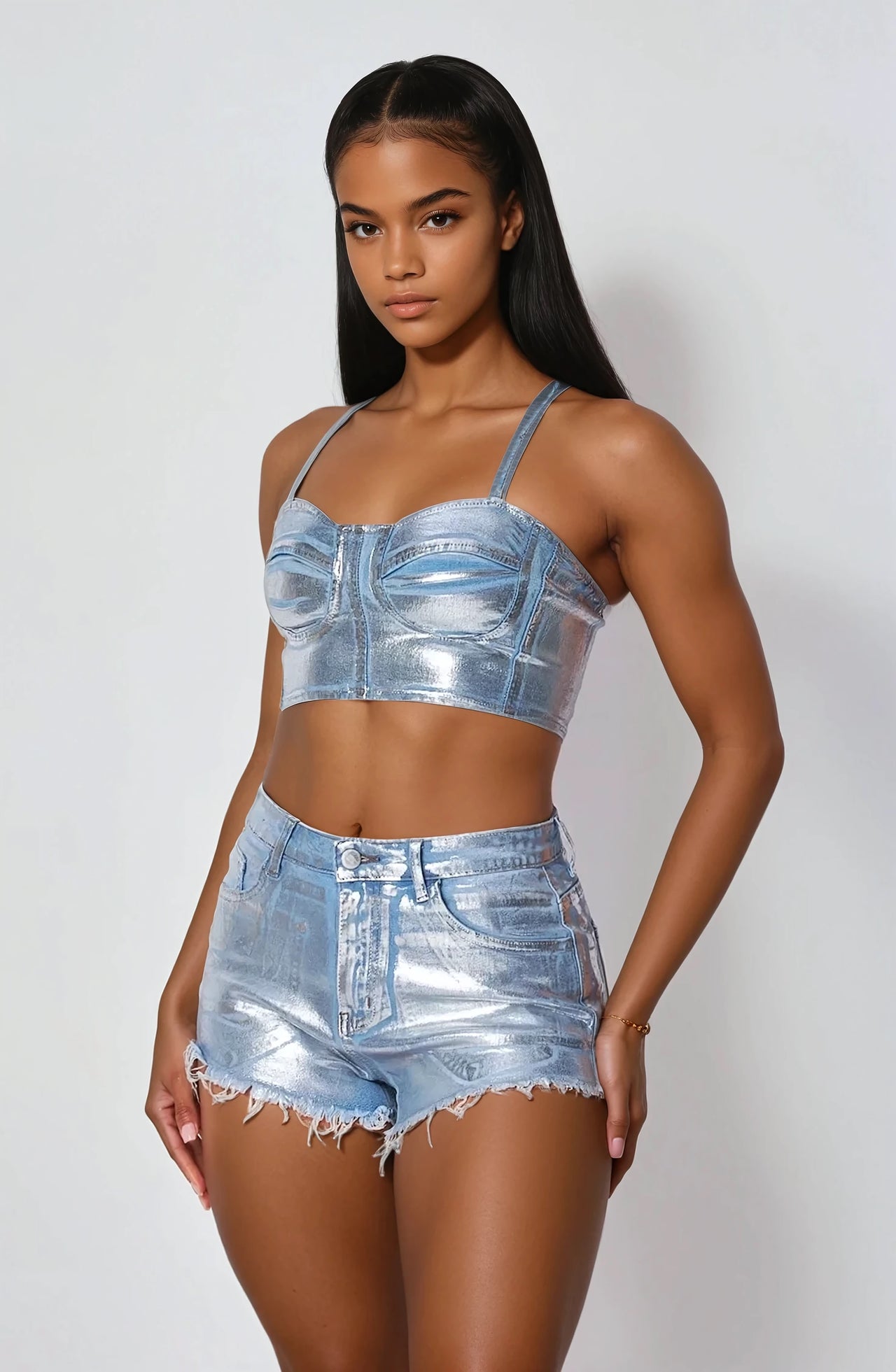 The No Limits Metallic Crop Top & Jean Shorts Outfit features a metallic foil finish crop bustier top with a back zipper and high-rise button-front shorts, perfect for stylish streetwear.