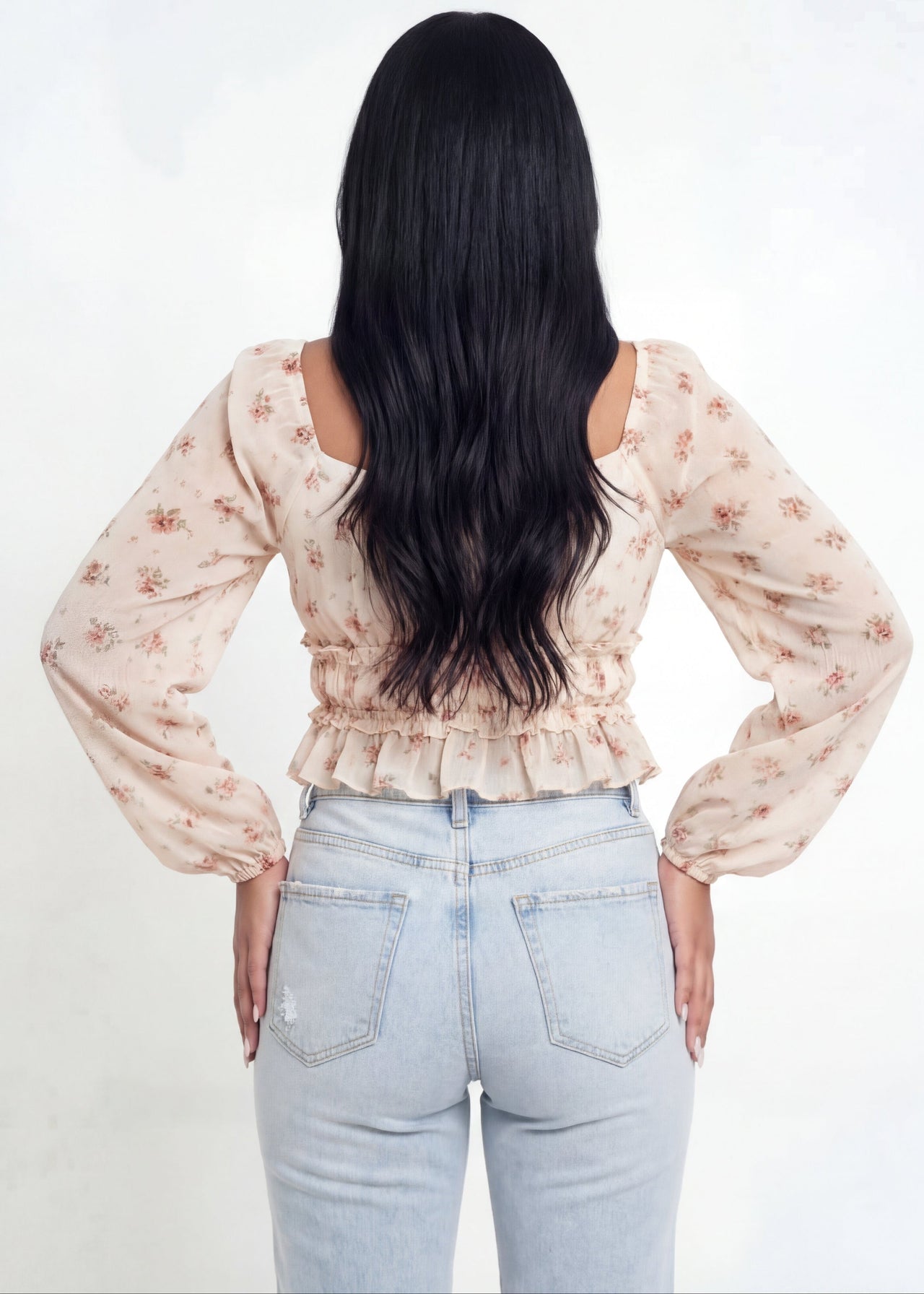 Pink seal floral blouse and light blue jeans on a white background