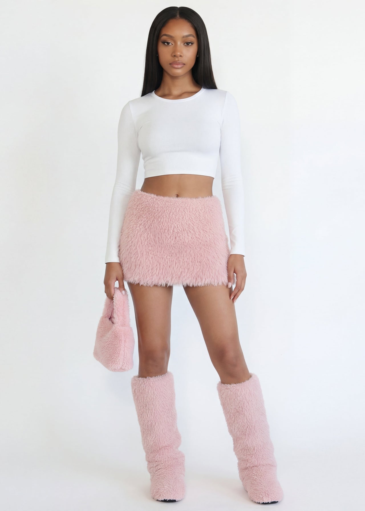 Women wearing a white top, Pink Seal Soft faux fur pink mini skirt with elastic waist and full lining.