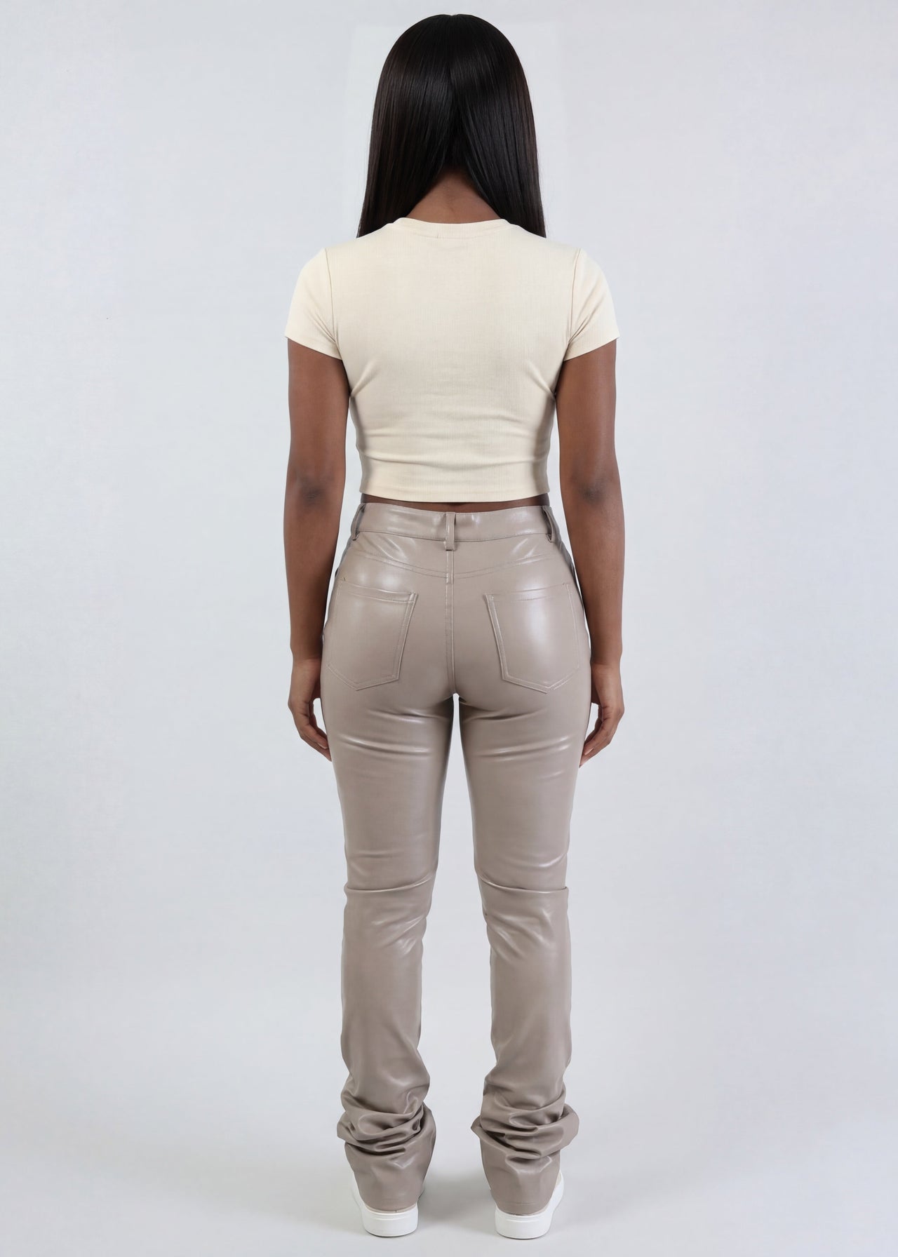 women wearing Pink Seal tan leather pants