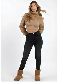 Thumbnail for Pink Seal Scarlett heavy knitted shrug beige sweater, black skinny jeans, and brown boots on a white background