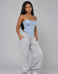 Thumbnail for Lady wearing denim bodysuit with light grey joggers.