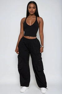 Thumbnail for Bold & laid-back. V-neck crop top and cargo pants with utility details for confident everyday streetwear.