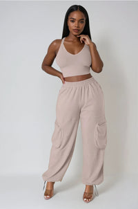 Thumbnail for Bold & laid-back. V-neck crop top and cargo pants with utility details for confident everyday streetwear.