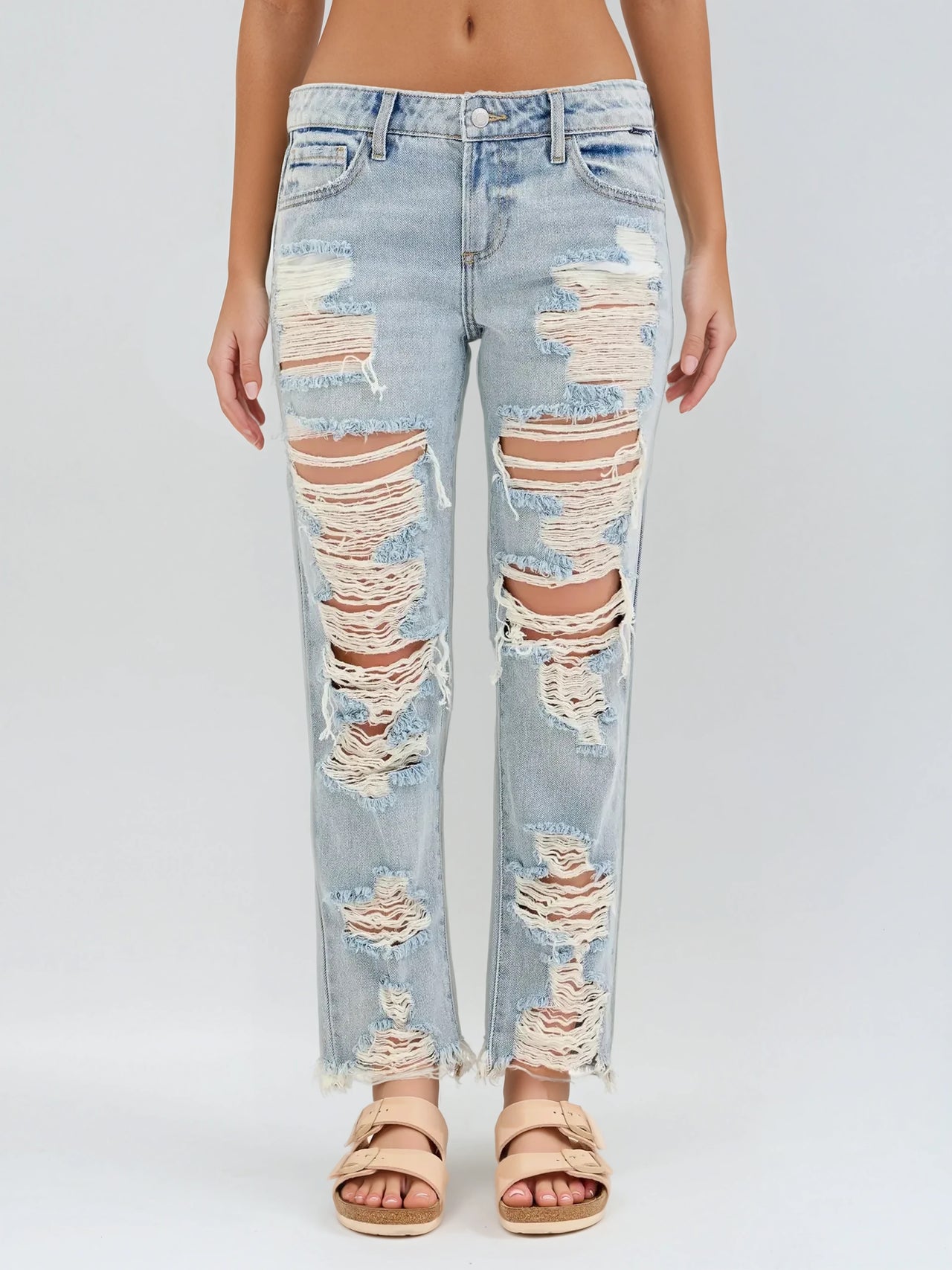 Light wash slouch Boyfriend jeans with frayed hems and distressed detailing. Bold streetwear with effortless edge.