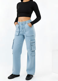 Thumbnail for Woman wearing a black long-sleeve top and Pink Seal light blue cargo pants, holding a black handbag on a white background.