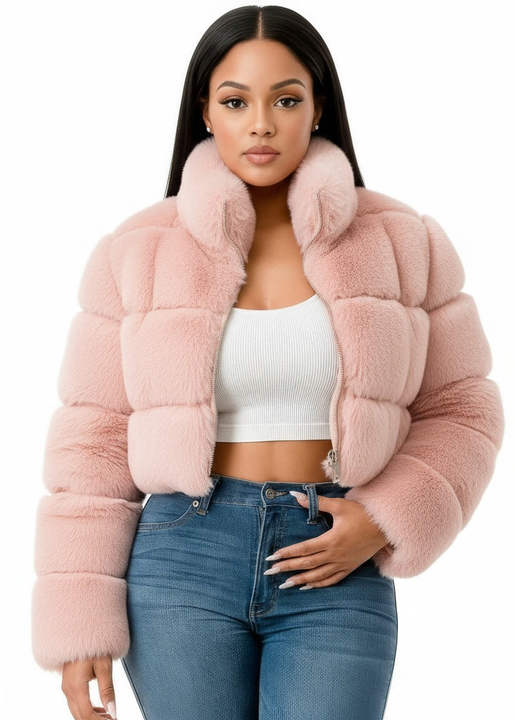 Woman wearing a pink fur jacket on a white background