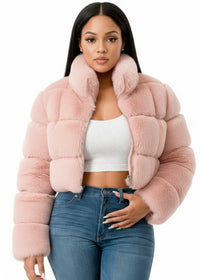 Thumbnail for Woman wearing a pink fur jacket on a white background