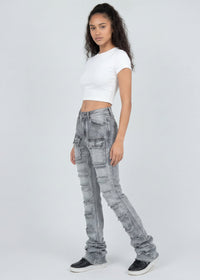 Thumbnail for Woman wearing light grey jeans and a white top on a white background