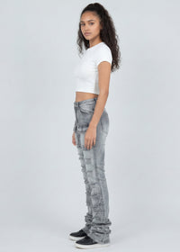 Thumbnail for Woman wearing light grey jeans and a white top on a white background