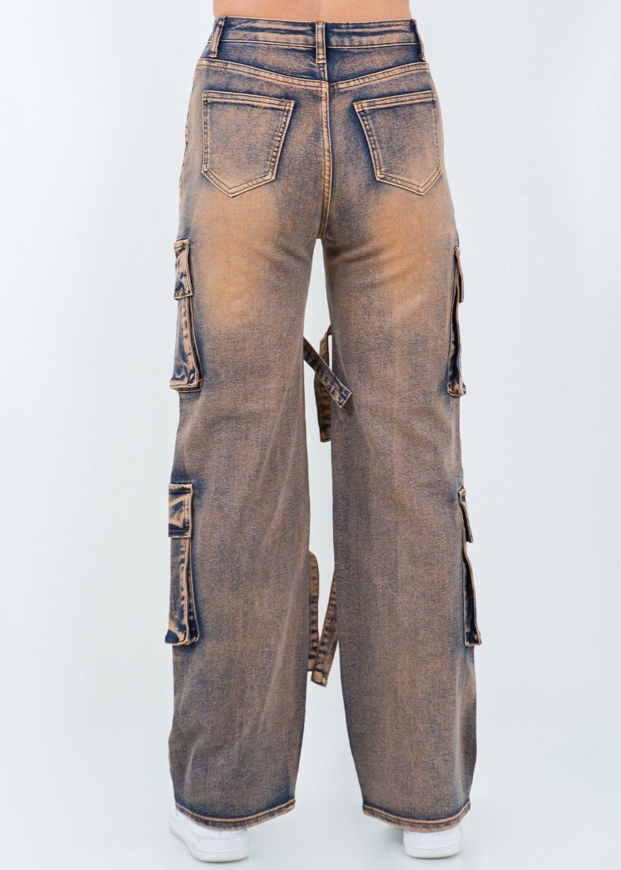 Utility-style cargo pants with strap trims and a wide-leg fit. Strong lines, bold presence.
