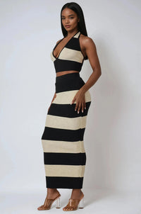 Thumbnail for Woman wearing a black and white two piece crop top and maxi skirt on a white background