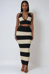 Thumbnail for Woman wearing a black and beige striped halter top and maxi skirt outfit against a white background