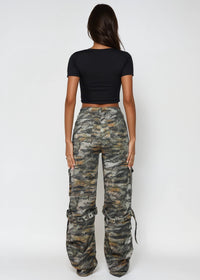 Thumbnail for Person wearing camouflage pants and a black top on a white background