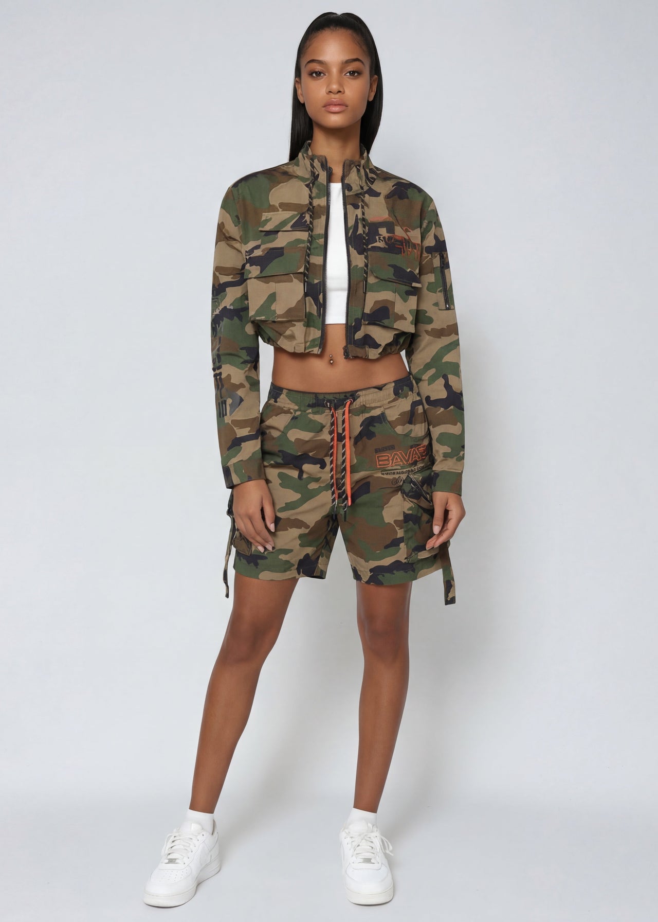 Pink Seal Women's Nylon Camo Shorts, featuring utility slouch fit, cargo pockets, double drawstrings & stretchy nylon fabric.
